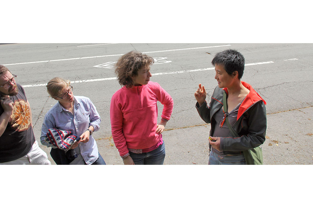 Hui, at right and Goldberg discuss grafting, while two friends look on.