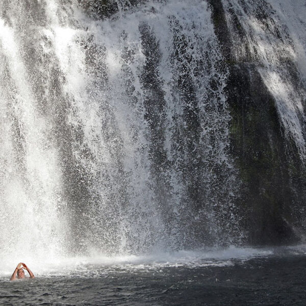 Middle McCloud River Falls, CA — “You tend to think about the purpose and why we’re here, [the] salmon coming up,” said Dr. Dennie Schulteis after his ceremonial swim at the middle falls of the McCloud River. — July 10, 2019